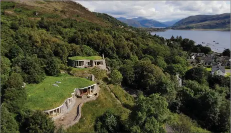  ??  ?? The twin Stone Houses almost blend into the side of Ullapool hill