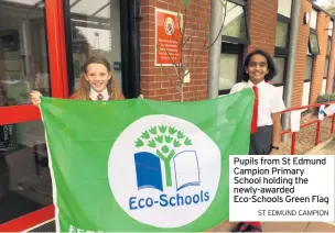 ?? ST EDMUND CAMPION ?? Pupils from St Edmund Campion Primary School holding the newly-awarded Eco-schools Green Flag