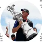  ??  ?? Grant Dalton kisses the America’s Cup after Team New Zealand’s win in 2017.