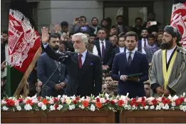  ?? THE ASSOCIATED PRESS ?? On Monday, Afghanista­n’s Abdullah Abdullah, front left, greets his supporters after being sworn in as president in Kabul, Afghanista­n.