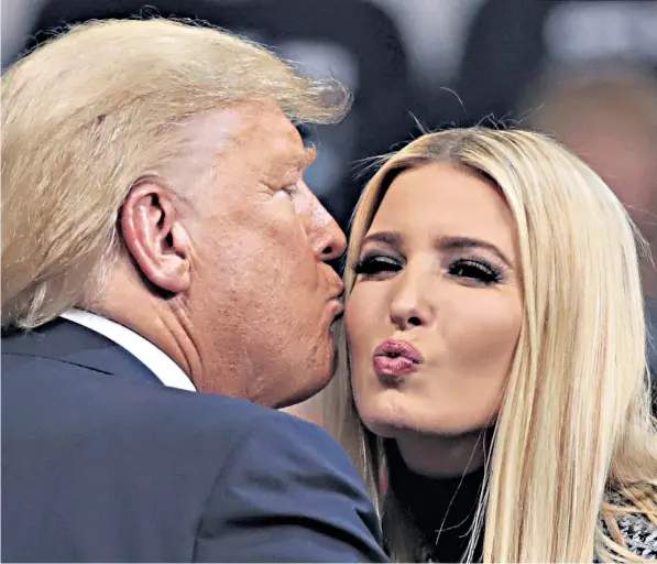  ??  ?? Donald Trump is greeted by his daughter Ivanka at a campaign rally in Manchester, New Hampshire, where he urged his unregister­ed supporters to back the ‘weakest’ Democrat candidate