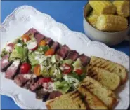  ?? SARA MOULTON VIA AP ?? This photo shows a grilled steak salad in New York. This dish is from a recipe by Sara Moulton.