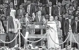  ?? AP/BEN CURTIS ?? Kenyan President Uhuru Kenyatta (center), takes the oath of office Tuesday at Kasarani stadium in Nairobi.