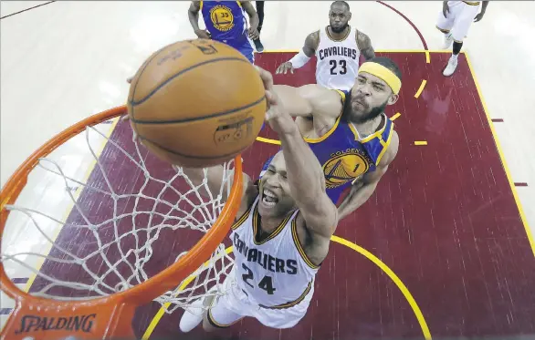  ?? LARRY W. SMITH/THE ASSOCIATED PRESS ?? Cavaliers forward Richard Jefferson tries to dunk as Golden State Warriors centre JaVale McGee defends during Game 4 of the NBA Finals on Friday.