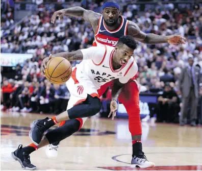  ?? VAUGHN RIDLEY / GETTY IMAGES ?? Toronto’s Delon Wright and the Raptors won a franchise record 25 games on the road this season.