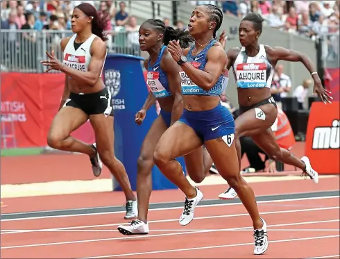  ??  ?? Sprint finish: Shelly-Ann Fraser-Pryce edges Dina Asher-Smith into second place in the 100m final at the Anniversar­y Games
