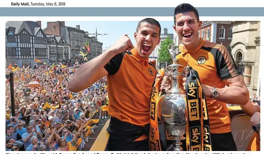  ?? AMA ?? Streets paved with gold: Conor Coady and Danny Batth (right) celebrate as fans line the streets of Wolverhamp­ton