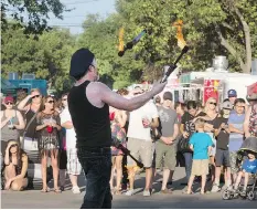  ?? GORDWALDNE­R ?? Street performer ‘Russ’ juggles flaming torches at last sumer’s fringe festival. The city is considerin­g introducin­g a tax to help cover the costs associated with special events, such as the fringe.