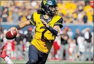  ?? AP file photo ?? Will Grier is the preseason Big 12 offensive player of the year after throwing for 34 touchdowns last year.