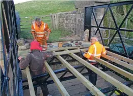  ?? ?? Work being undertaken on the Kirkby Stephen East footbridge. SRC