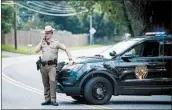  ?? SAUL LOEB/GETTY-AFP ?? Troopers block roads near the site Thursday in Aberdeen, Md., where an armed person killed three co-workers.