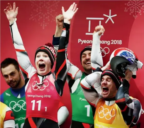  ?? Dan Istitene/Getty Images ?? Four years of team-relay luge frustratio­n came to an end at Olympic Sliding Centre in Pyeongchan­g, South Korea, Thursday as Team Canada — Alex Gough, second from left, Sam Edney, Justin Snith and Tristan Walker (not pictured) — captured a silver medal.