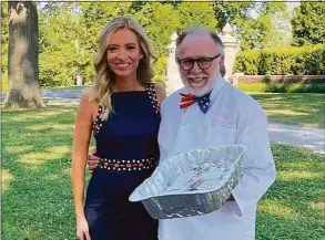  ?? Contribute­d photo / Frances Mercede ?? Kayleigh McEnany of Fox News at Waveny Park in New Canaan on July 4, where she was reporting on the fireworks. With her is Sky Mercede, owner of Forever Sweet Bakery in Norwalk, which supplied cupcakes and cookies at the event.