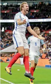  ?? — AP ?? England’s Harry Kane celebrates after scoring the goal during the World Cup qualifying match against Slovenia at Wembley stadium in London.