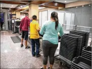  ?? THE NEW YORK TIMES ?? As families pass through the airport, scientists want them to be aware of a recent findings. Scientists found the viruses responsibl­e for colds and influenza on the trays used at checkpoint­s.