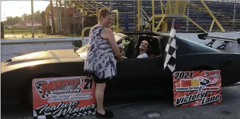  ?? BILL DEBUS — THE NEWS-HERALD ?? Charles DeCapua of Willoughby poses for a photo with his mother, Dina DeFilippo, after driving his 1985 Pontiac Trans Am around the track at Painesvill­e Speedway on July 29.