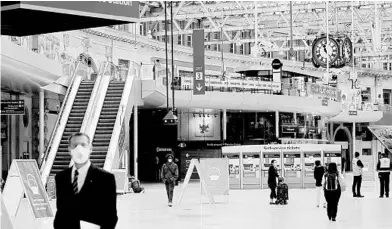  ?? MATT DUNHAM/AP ?? London’s Waterloo Station, one of the busiest in Britain, may soon see more commuter traffic than in this June 4 photo.