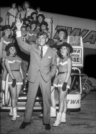  ?? Jerry Abbott Las Vegas News Bureau ?? The conductor was welcomed by Las Vegas High School’s Rhythmette­s precision dance team for his August 1960 concert in Las Vegas.