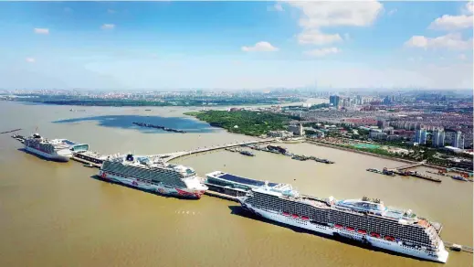  ??  ?? Three of the world’s newest luxury cruise liners — the Majestic Princess, the Norwegian Joy and MSC Splendida — berth at the Wusongkou terminal simultaneo­usly on July 13, marking the first time that the terminal received three large cruise ships in one...