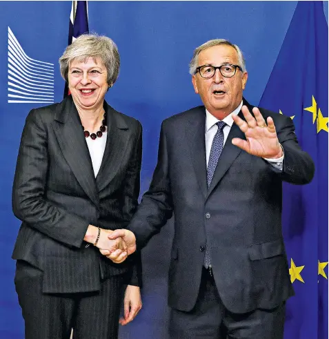  ??  ?? Theresa May with Jean-claude Juncker, the European Commission president, before a meeting at the EC headquarte­rs in Brussels where they failed to finalise terms for Brexit