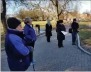  ?? PROVIDED PHOTO ?? Daughters of the American Revolution held a wreathlayi­ng ceremony Friday to remember those who perished during the Japanese attack on Pearl Harbor.