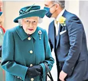  ?? ?? Oct 1: The Queen and the Prince of Wales plant a tree at Balmoral Castle as part of a special initiative marking her Platinum Jubilee.
Oct 2: Opening the new session of the Scottish Parliament, right, giving a speech in which she urges MSPS to “help create a better, healthier future” by tackling climate change.