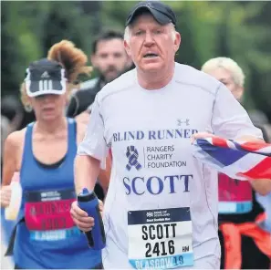  ??  ?? Keep on running Scott has taken part in various races for charity