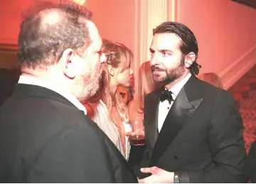  ??  ?? Weinstein, left, and actor Bradley Cooper attend the Bloomberg Vanity Fair White House Correspond­ents’ Associatio­n dinner after-party in Washington in 2013.