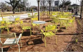  ??  ?? Visitors to Levy Park can move the outdoor tables and chairs.