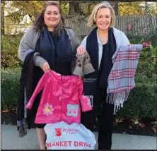  ??  ?? Yvonne Wysocki and Julia Greene are amongst hundreds of Realtors collecting donations from November 18 to 25 for the
25th Annual Realtors Care Blanket Drive - the longest-running and largest warm clothing and blanket drive in the Lower Mainland.