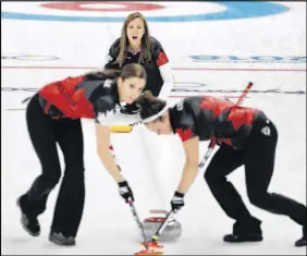  ?? AP PHOTO ?? Canada’s skip Rachel Homan watches teammates Joanne Courtney, right, and Lisa Weagle, left, sweep during a women’s curling match against China.