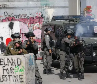  ?? AP ?? Israeli security forces fire tear gas at Palestinia­n protesters in Bethlehem yesterday