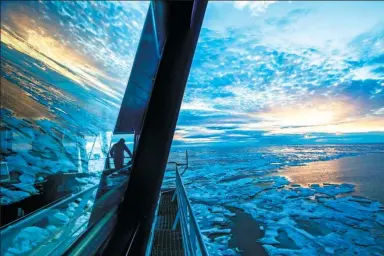  ?? DAVID GOLDMAN / ASSOCIATED PRESS ?? Nigel Greenwood, assistant ice navigator, guides the Finnish icebreaker MSV Nordica as it traverses the Northwest Passage in the Arctic.