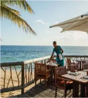  ??  ?? Dine by the beach at Castaway Island Resort.