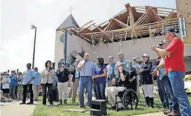  ?? [AP FILE PHOTO] ?? Vice President Mike Pence, with his wife, Karen, speaks to residents affected by Hurricane Harvey on Aug. 31 during a visit to the First Baptist Rockport Church in Rockport, Texas.