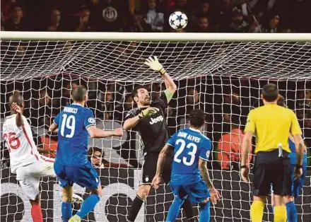  ?? AFP PIC ?? Juventus goalkeeper Gianluigi Buffon tips over a shot at goal during their Champions League semifinal match against Monaco on Wednesday. Juventus won 2-0.