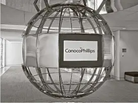  ?? ConocoPhil­lips via Associated Press ?? ConocoPhil­lips reported that it lost $3.4 billion, or $2.78 a share, in the second quarter as it wrote off the value of some assets. The largest independen­t oil company in the U.S. also said it cut its debt by $3 billion in the quarter.