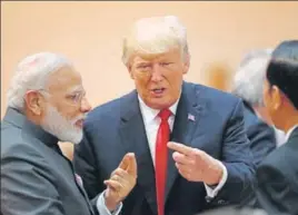  ?? GETTY IMAGES ?? Prime Minister Narendra Modi talks with US President Donald Trump on the second day of the G20 economic summit in Hamburg, Germany on Saturday. As G20 leaders continued their discussion­s, Trump walked up to Modi for “an impromptu interactio­n”.