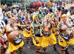  ??  ?? Artists take part in the Atham Onam procession in Kochi on Friday.