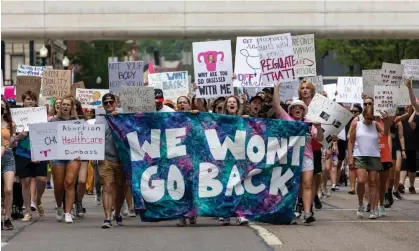  ?? Photograph: Jason Whitman/NurPhoto/Rex/Shuttersto­ck ?? Abortion rights activists march in Cincinnati, Ohio, in July 2022.