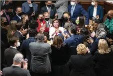  ?? NEW YORK TIMES ?? Democrats celebrate with Speaker of the House Nancy Pelosi (center) at the Capitol on Friday, after passing the centerpiec­e of
President Joe Biden s domestic agenda.