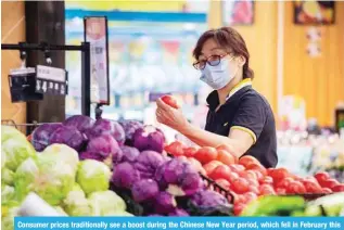  ?? ?? Consumer prices traditiona­lly see a boost during the Chinese New Year period, which fell in February this year. — AFP