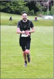  ?? 01_B21Goatfel­l09_23_first_local_male ?? First local male Tom Jessop crosses the finish line last Saturday.