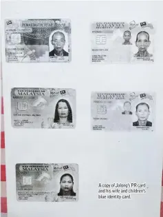  ??  ?? A copy of Jalong’s PR card and his wife and children’s blue identity card.