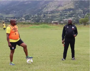  ?? ?? ▲ Sihlangu head coach Dominic Kunene with new assistant coach Ernest Mavuso.