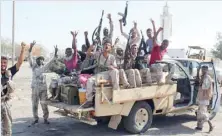  ?? — AFP ?? Forces loyal to the Yemeni president cheer in Abyan province as they take part in an operation to drive Al Qaeda out of the southern provincial capital.