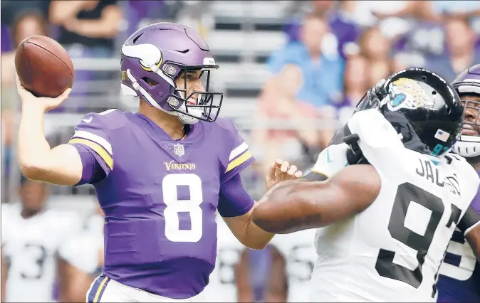  ?? BRUCE KLUCKHOHN | AP ?? THE VIKINGS CLEANED HOUSE, getting rid of three quarterbac­ks from an NFC championsh­ip team, to make room for free agent Kirk Cousins, who arrives with a three-year, $84 million dollar deal and the pressure to deliver the Vikings’ first championsh­ip.