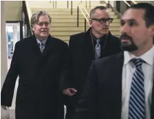  ?? EPA ?? Former Trump campaign manager and chief strategist Steve Bannon, left, leaves the building after he testified before the house intelligen­ce committee on Capitol Hill in Washington