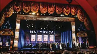  ??  ?? The cast and crew of “The Band’s Visit” accept the award for best musical.