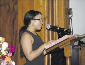  ?? ?? Maya Franklyn reads the letter that she penned to her late father.